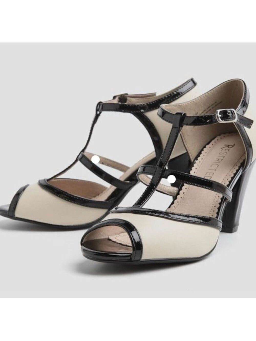 Restricted Cream and Black T-Strap Heels